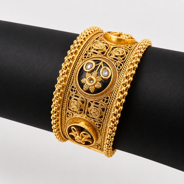 Intricate Gold Cuff with Gemstones